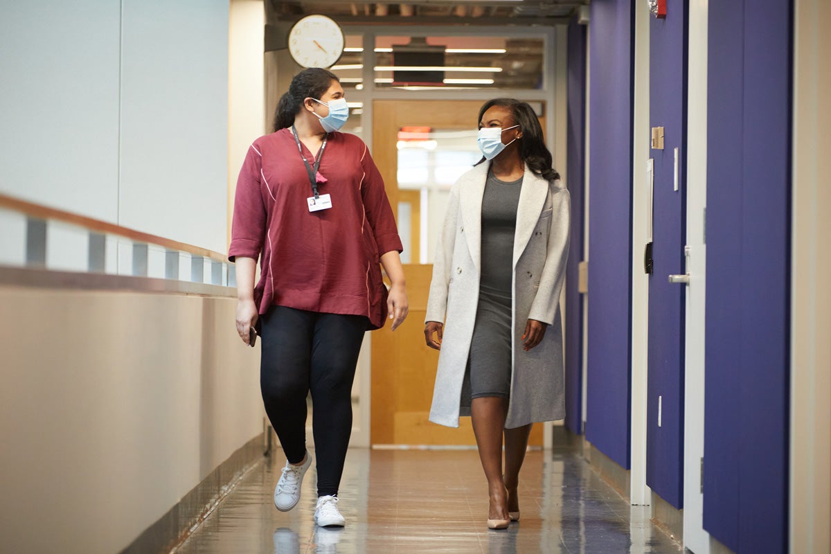 Corbett (right) with Maryam Ahmad, a research assistant in the Department of Immunology and Infectious Diseases.