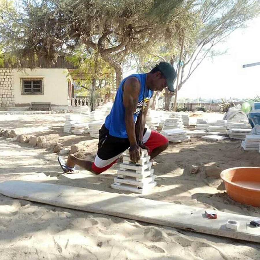 Pepin Emmanuel, a dive master for Reef Doctor, assembles a PVC ARMS in Ifaty.