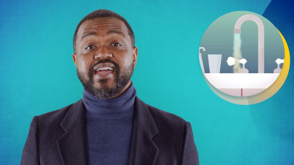 A still of Mighty Fine from the APHA "This is public health" series. He wears a navy turtleneck, a black blazer and is front of a teal screen. In the corner is an illustration of a facuet with running water inside a circle.
