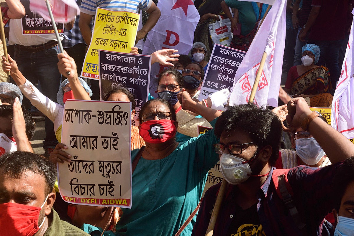Protesters shouting slogans while holding placards during the demonstration. Leftist organisation workers protest against West Bengal government demanding for better healthcare and facilities for both Covid 19 and Non-Covid 19 patients as well as protesting against recent deaths of students due to the lack of beds in hospitals.