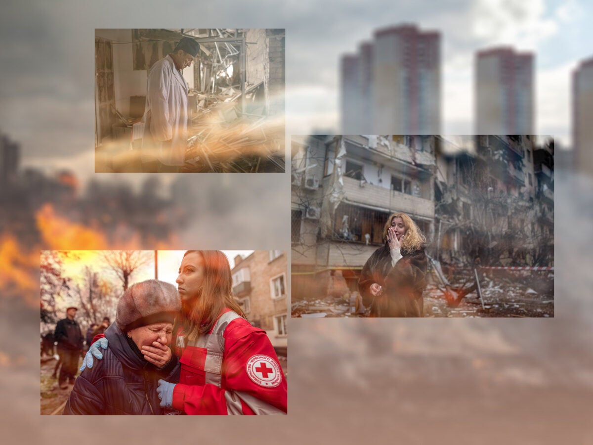 Three images from the war in Ukraine are overlaid onto of a blurred image of a burning field with apartments in the background. Images from top to bottom: A male Ukrainian doctor in a white lab coat and dark surgical cap, stands in the middle of a destroyed hospital interior. Rubble and building debris surround him. A blonde woman is overcome with emotion as she stands outside a destroyed apartment building. A Red Cross volunteer embraces an elderly woman crying.