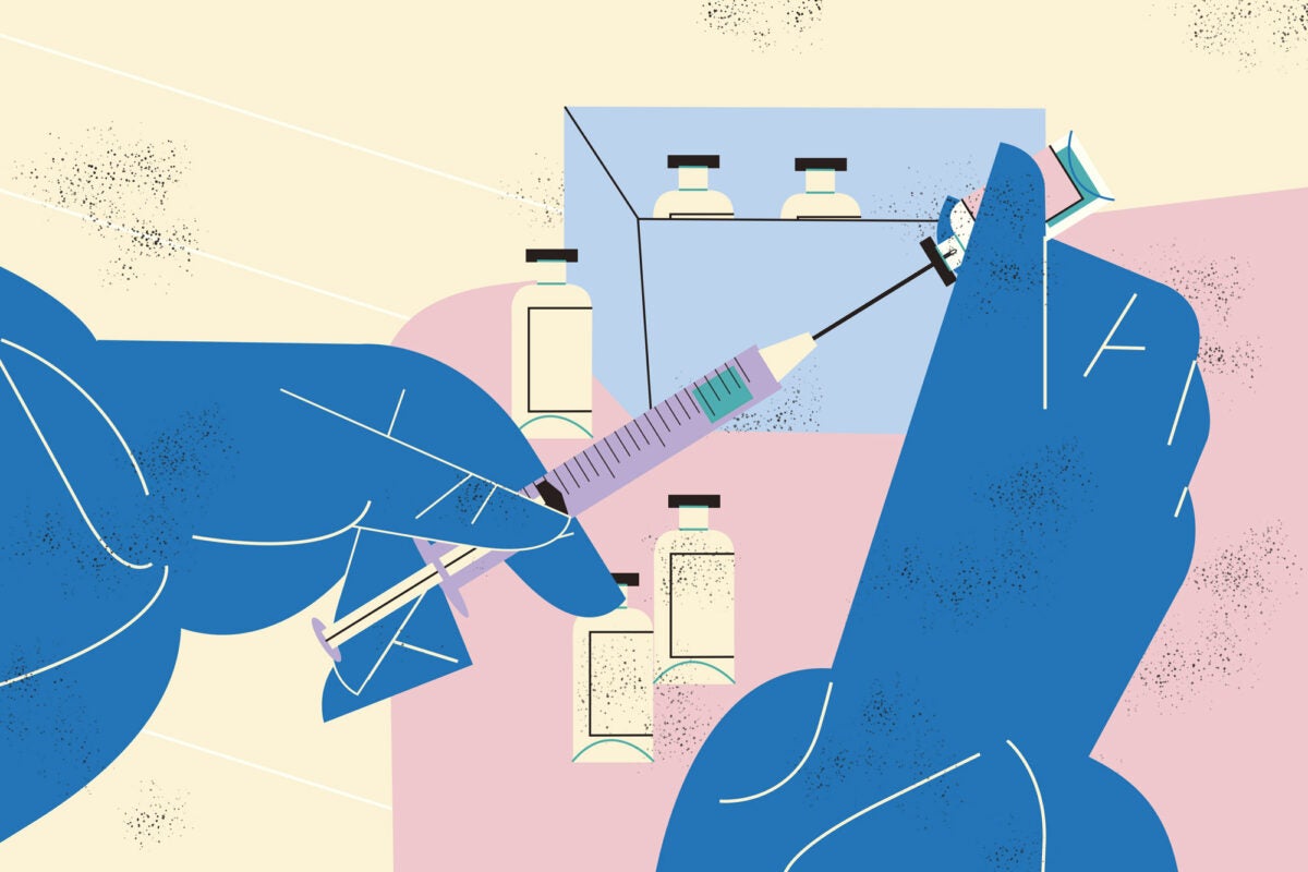 Illustration: Blue gloved hands extract a dose of a vaccine from a vial into a syringe. A pink tray with a box of vaccine vials is in the background. A few vials rest on the tray.