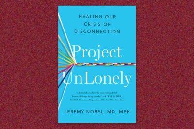Book cover of “Project UnLonely: Healing our crisis of disconnection” by Jeremy Nobel, MD MPH. The book cover is a bright blue with white serif type for the title and black sans serif for subtitle and author name. Eleven individual colored threads enter from the left side of the cover and converge in a braided line that intersects the title in the middle of the cover. The book cover is on a deep red background.