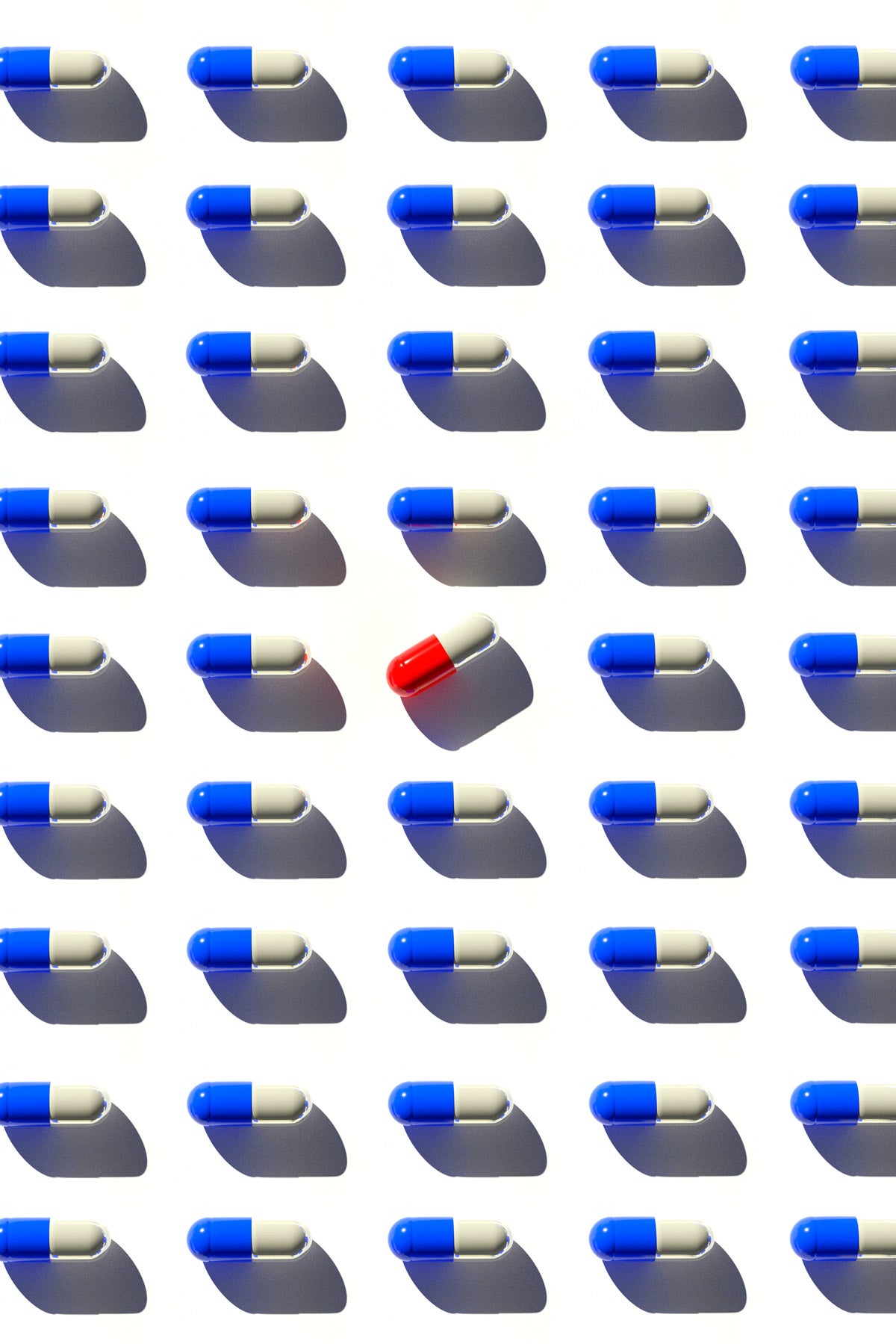 Organized rows of white and blue pill capsules. A white and red pill is in the center and turned 45 degrees.