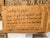 Close-up of a cardboard sign with handwritten text reading "Something to ponder: What if god occasionally visits Earth disguised as a homeless guy panhandling to see how charitable we are? Completely hypotehcial of course."