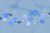 Illustration: A network of medical and data icons, gears, arrows, and connection points are overlain on a city map. The composition is shades of blue and grey.