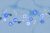 Illustration: A network of medical and data icons, gears, arrows, and connection points are overlain on a city map. The composition is shades of blue and grey.