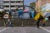 Children play soccer on Plaza Soledad's concrete steps and plaza. Colorful tents cover the landing at the top of the steps.